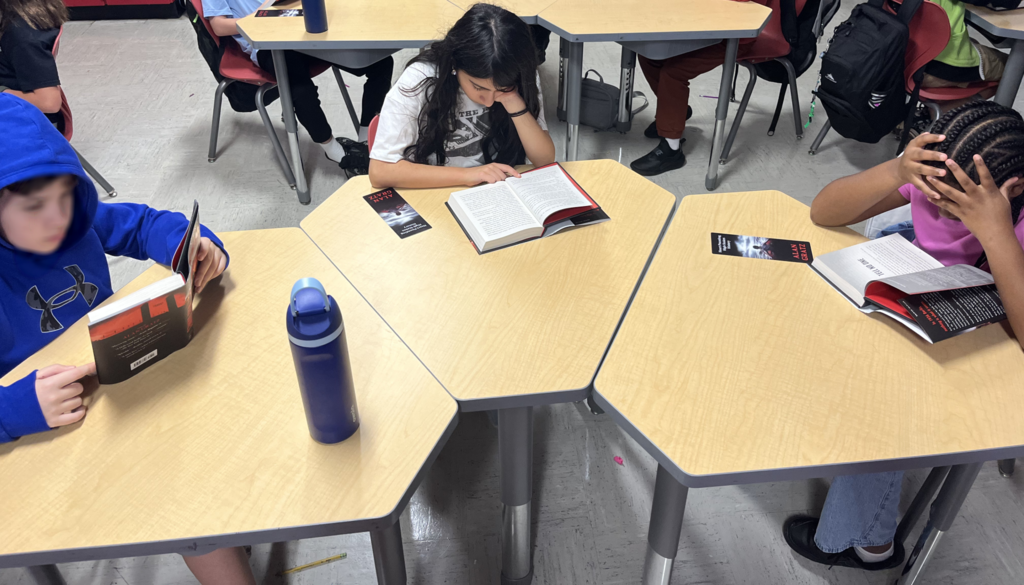 Students reading War Games