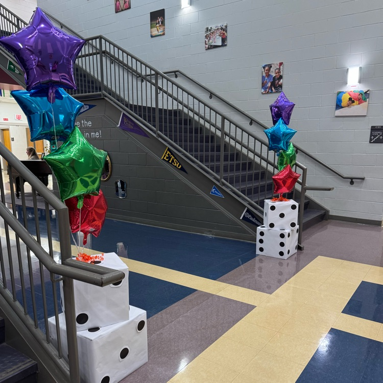 colorful star shaped balloons toes to boxes decorated to look Iile dice