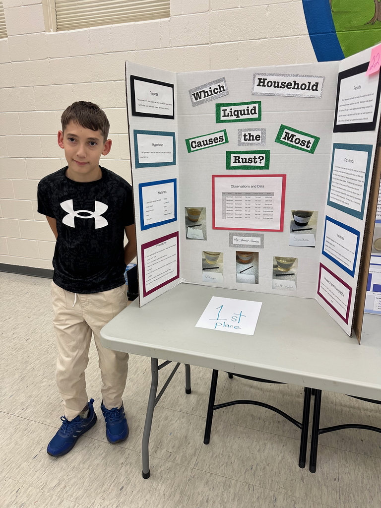 Javier with his poster "Which household liquid causes the most rust?" 