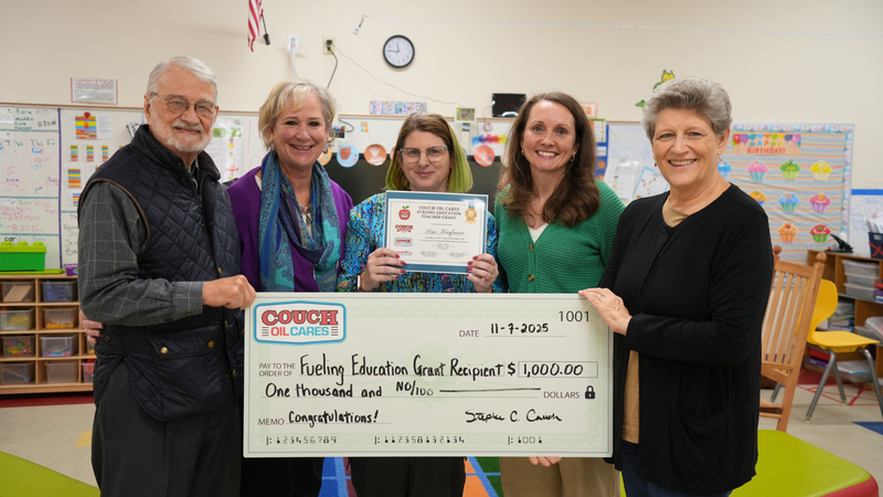  Representatives from Couch Oil visit Ms. Lisa Kaufman and CGE Principal Dr. Janice GIles to present a grant check.
