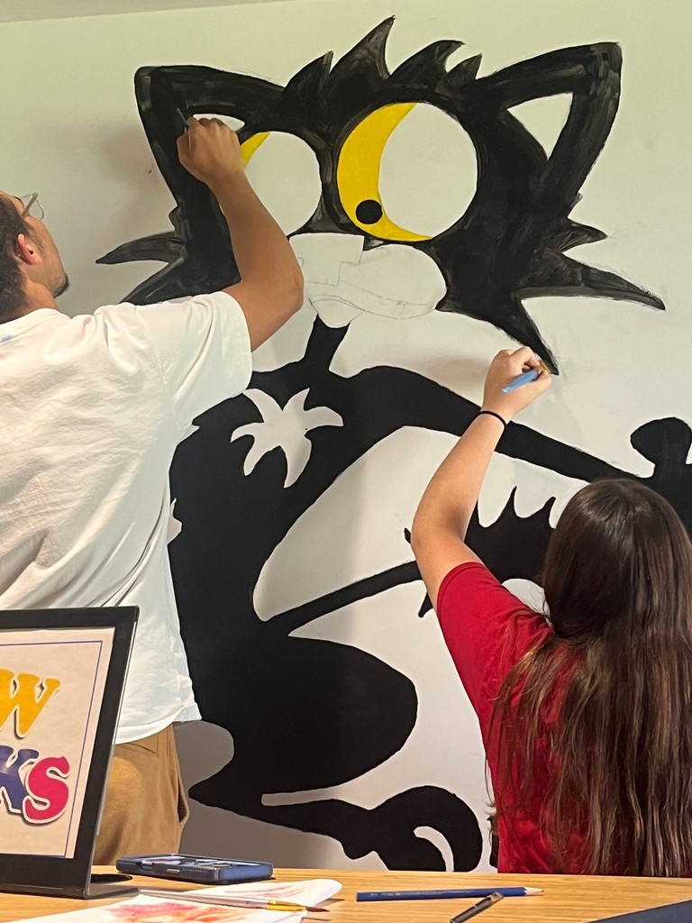 students painting mural