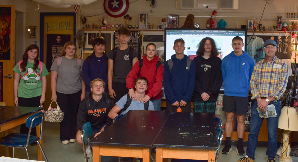 class picture of students with guest speaker