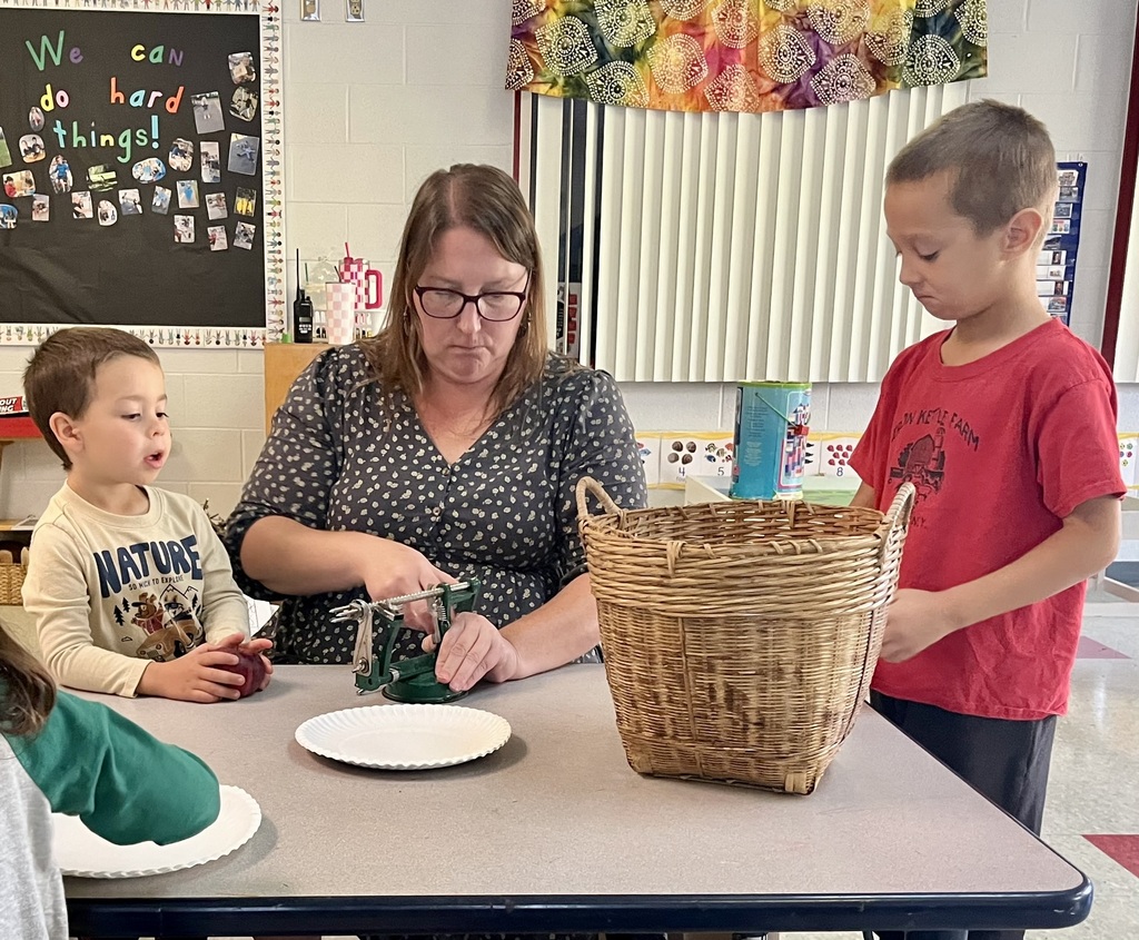 student peeling apples