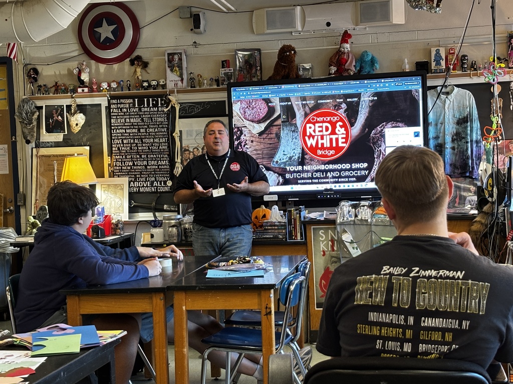 business owner speaking in front of class