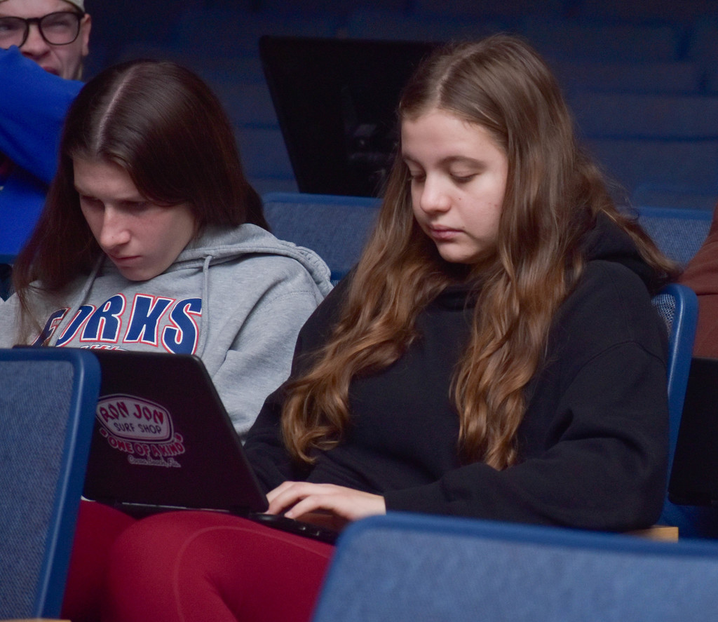 student filling out applications on computers