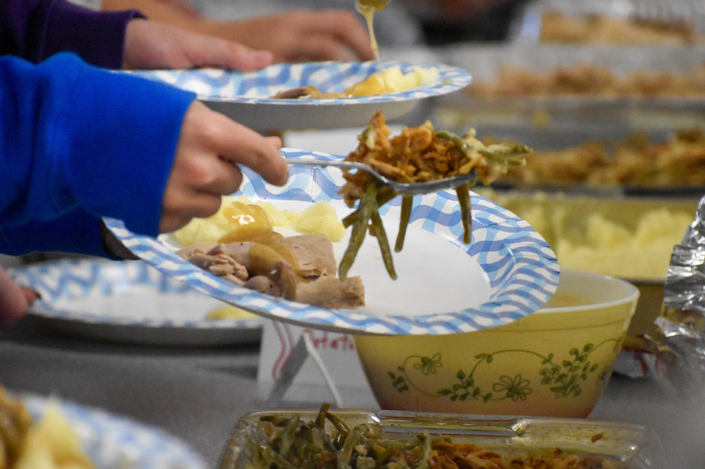 food being scooped on to plate