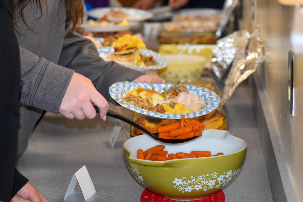 food being scooped on to plate