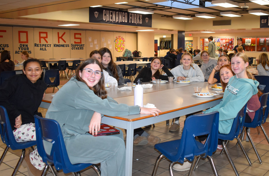 students at table eating