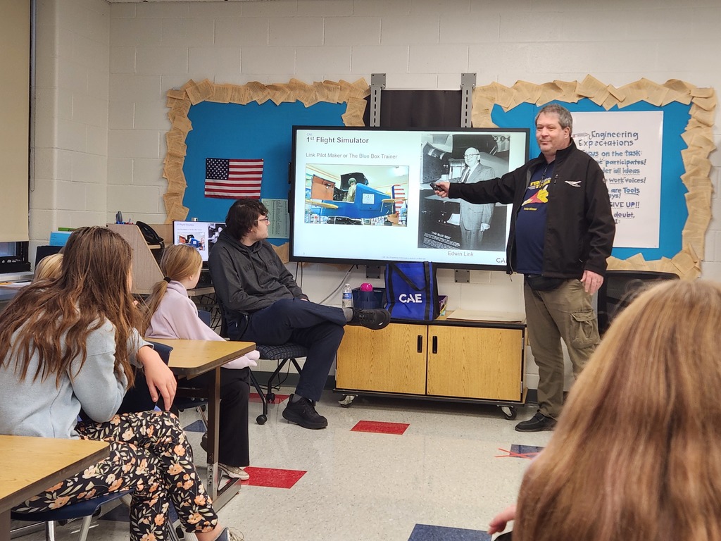 guest speaker speaking to robotics club students