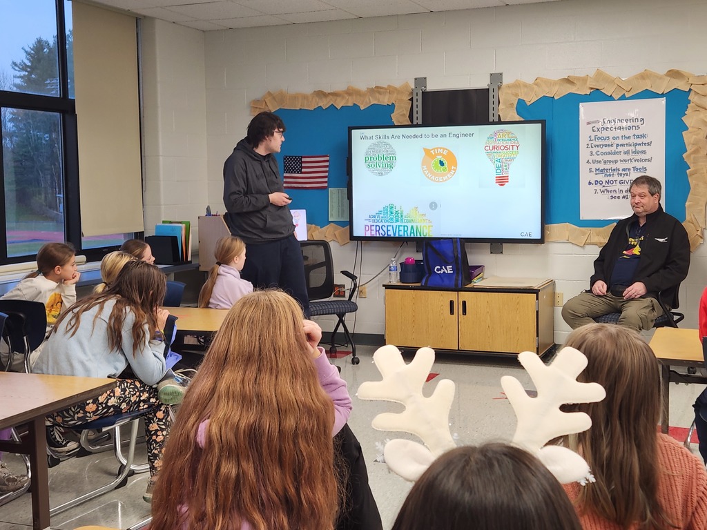 guest speaker speaking to robotics club students