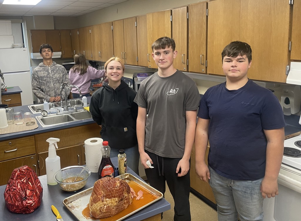students cooking in classroom kitchen