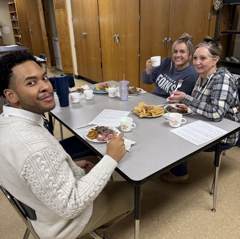 teachers eating meal in classroom