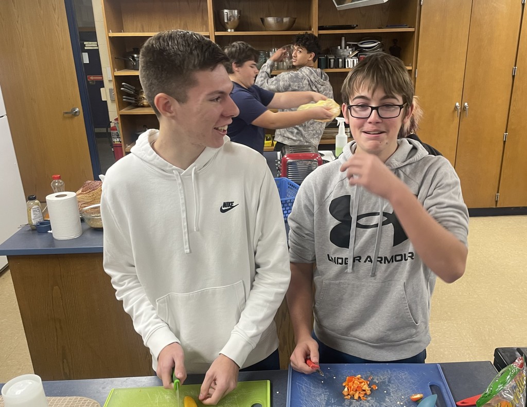 students cooking in classroom kitchen