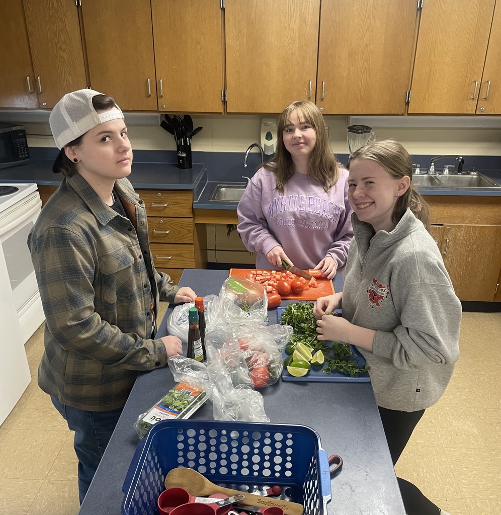 students cooking in classroom kitchen