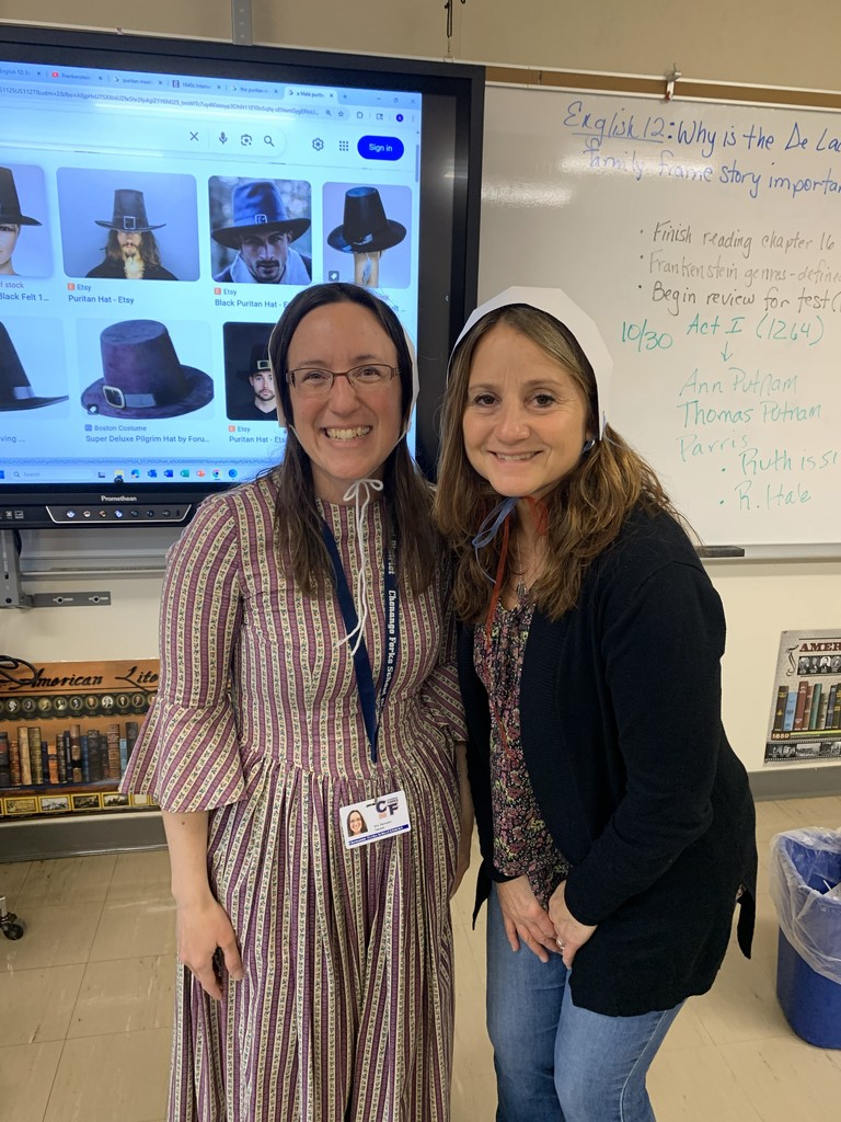 teachers in Puritan hats