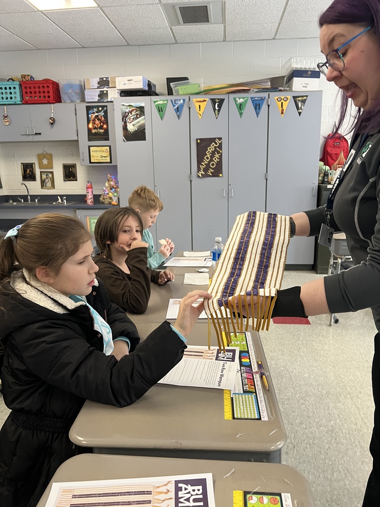 students with replica wampum belt