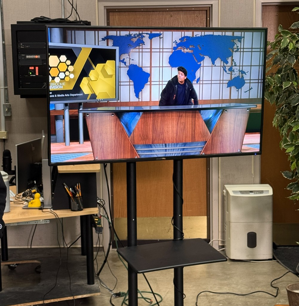 student in TV production studio