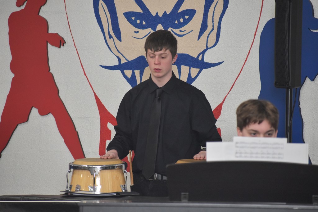 student playing drums
