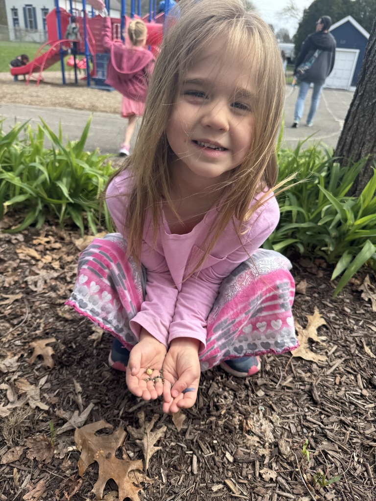 student planting flower seeds