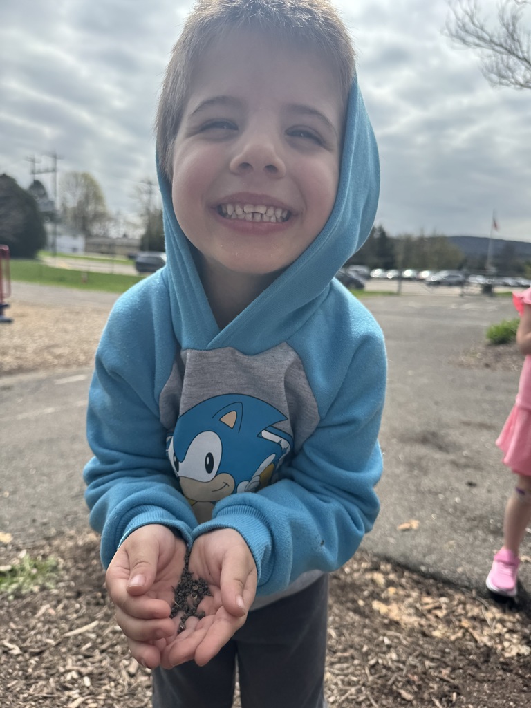 student planting flower seeds