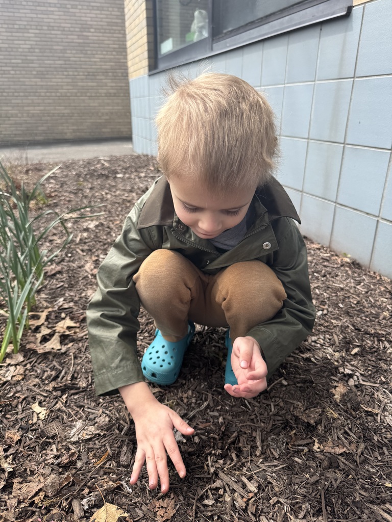 student planting flower seeds