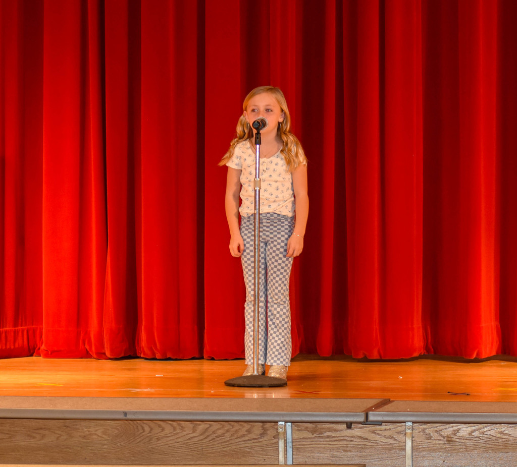 elementary student on stage