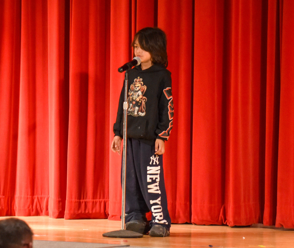 elementary student on stage
