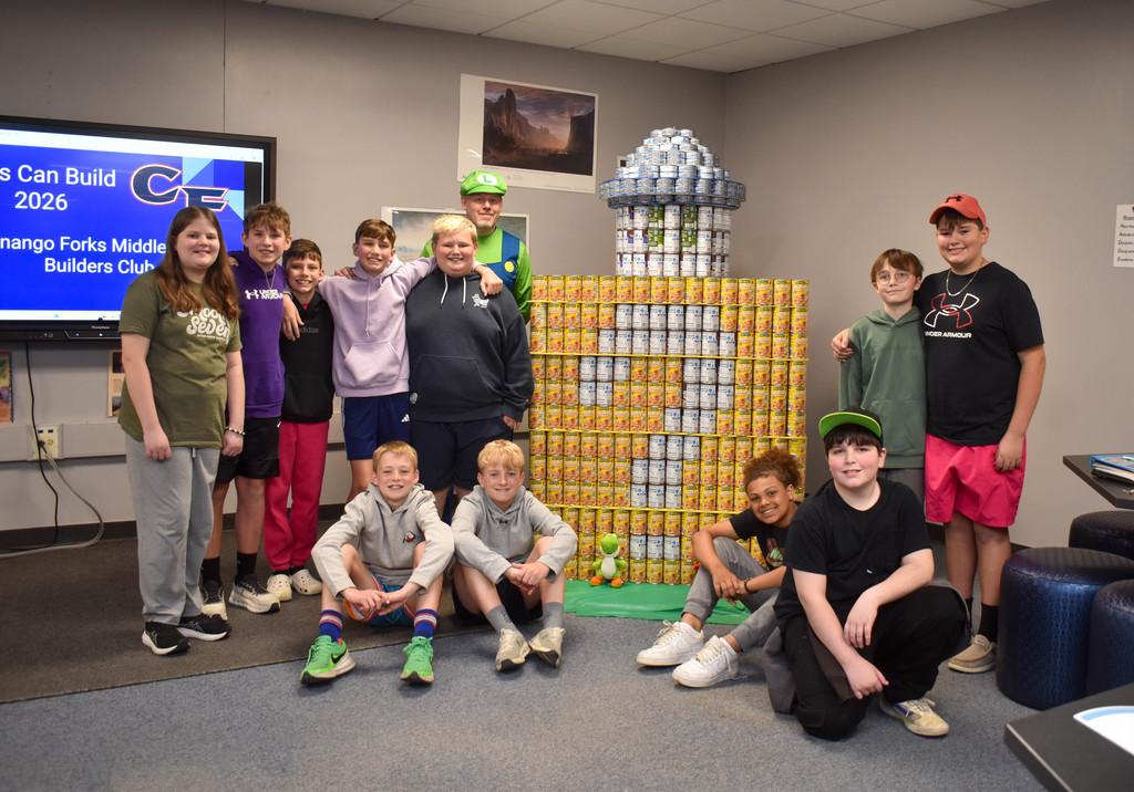 students building structure with cans