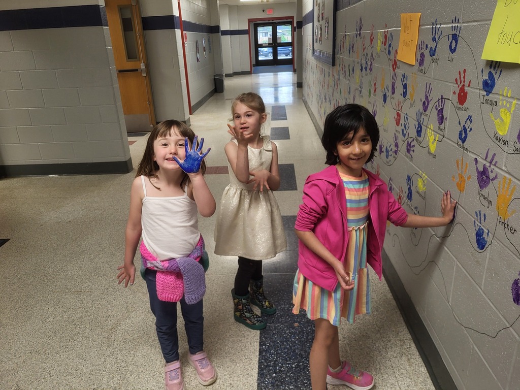 student handprints on wall