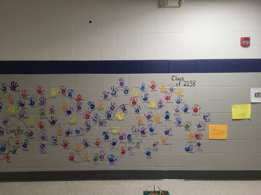 student handprints on wall