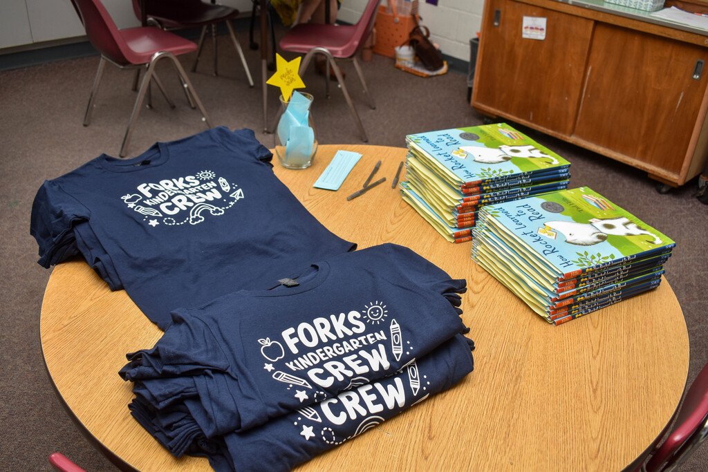 shirts and books on table