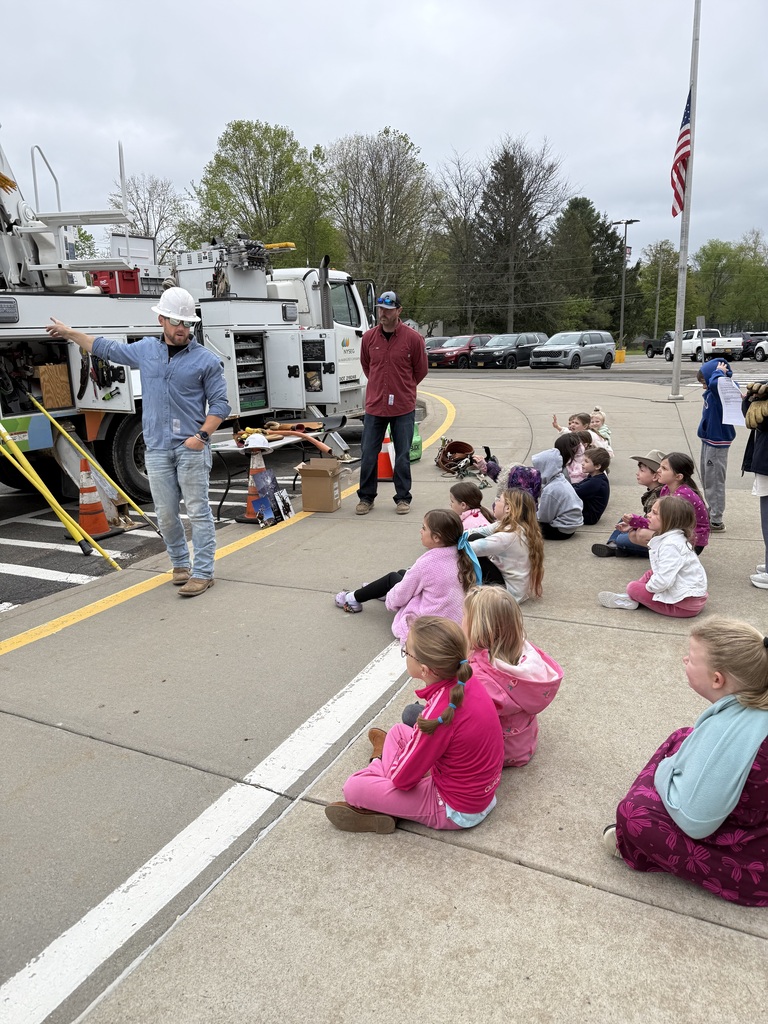 gust speaker with elementary students outside with truck
