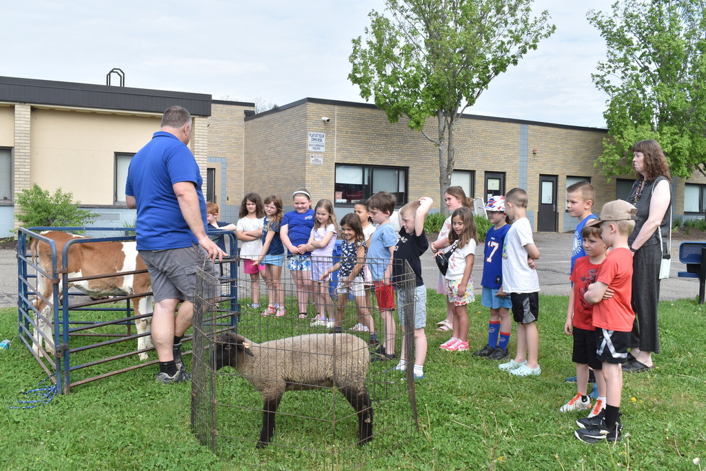 students outside with farm animals