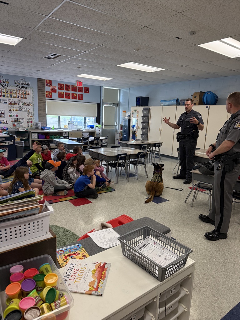 police office speaking to students