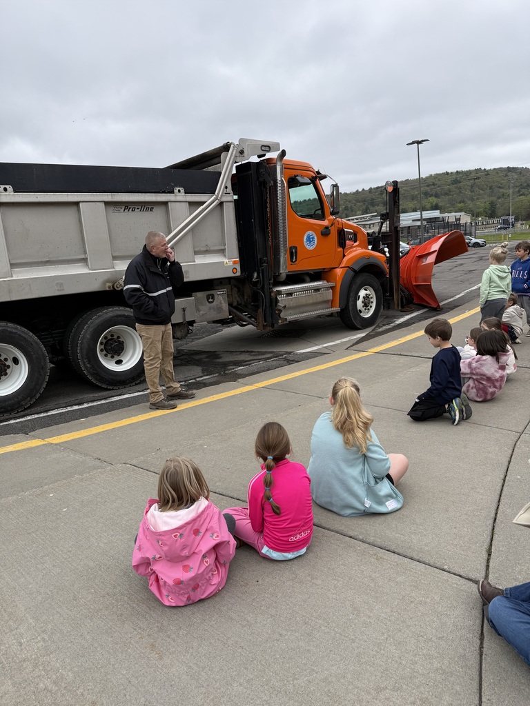students outside with truck