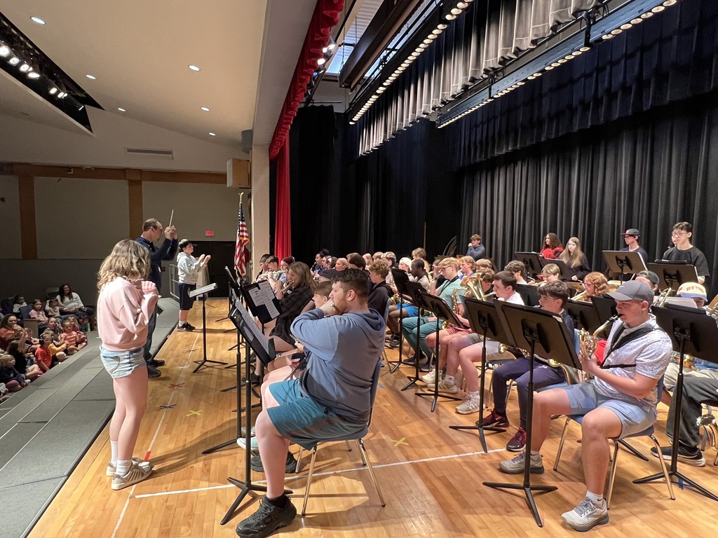 high school band performaning for elementary students 