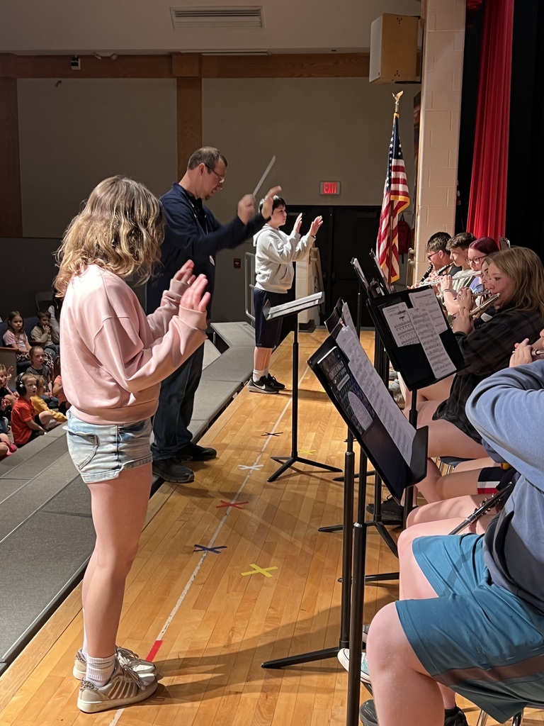 high school band performaning for elementary students 