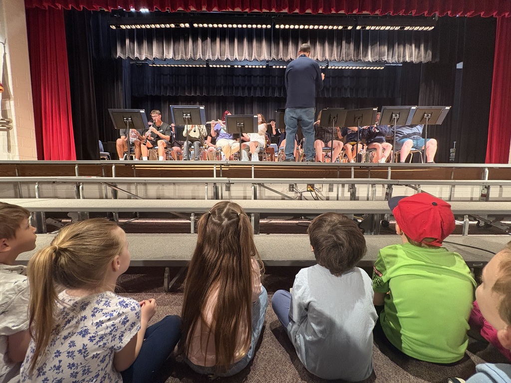 high school band performaning for elementary students 