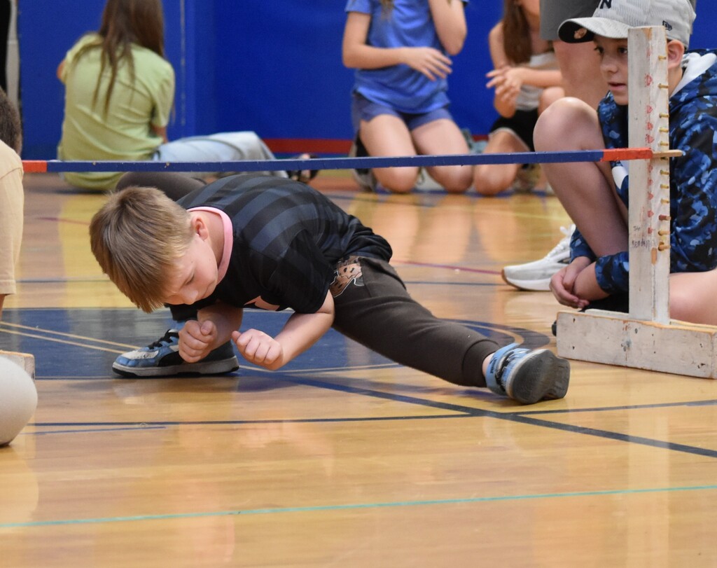 elementary students during limbo contest