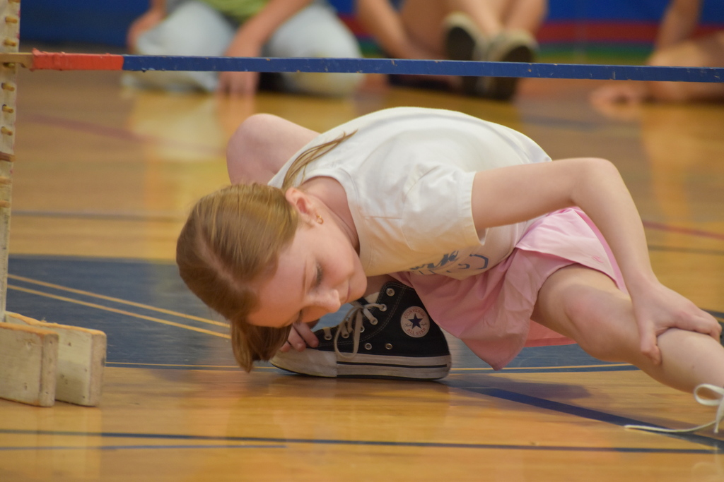 elementary student during limbo competition 