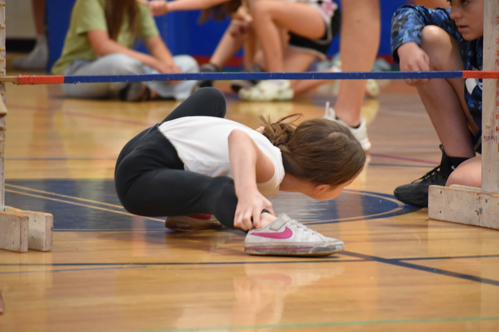 elementary student during limbo competition 