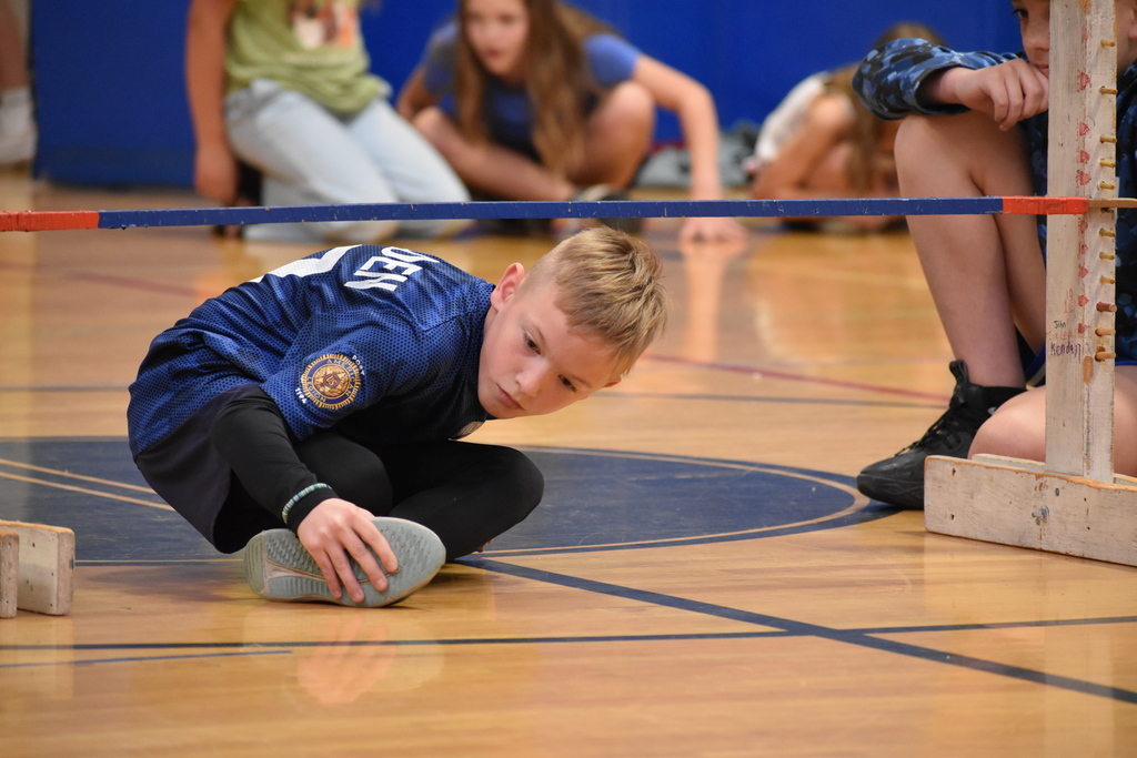 elementary student during limbo competition 