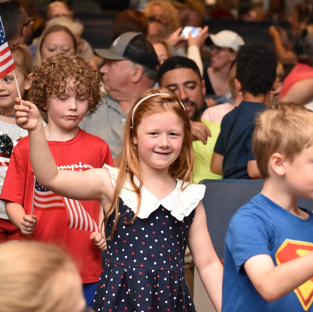 ELEMENTARY STUDENT DURING MEMORIAL DAY ASSEMBLY 
