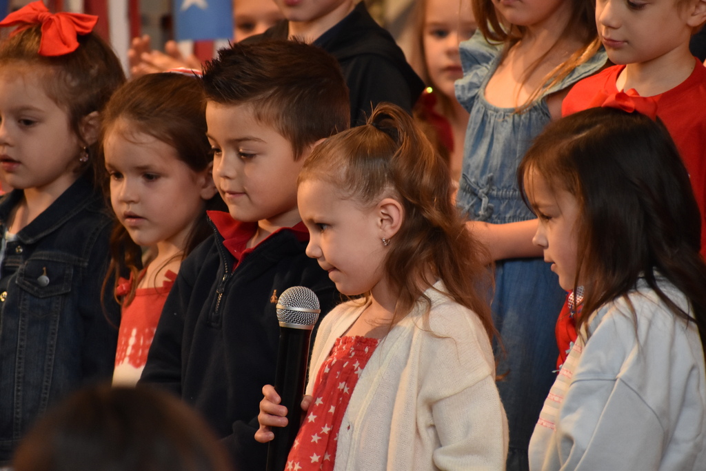 ELEMENTARY STUDENT DURING MEMORIAL DAY ASSEMBLY 