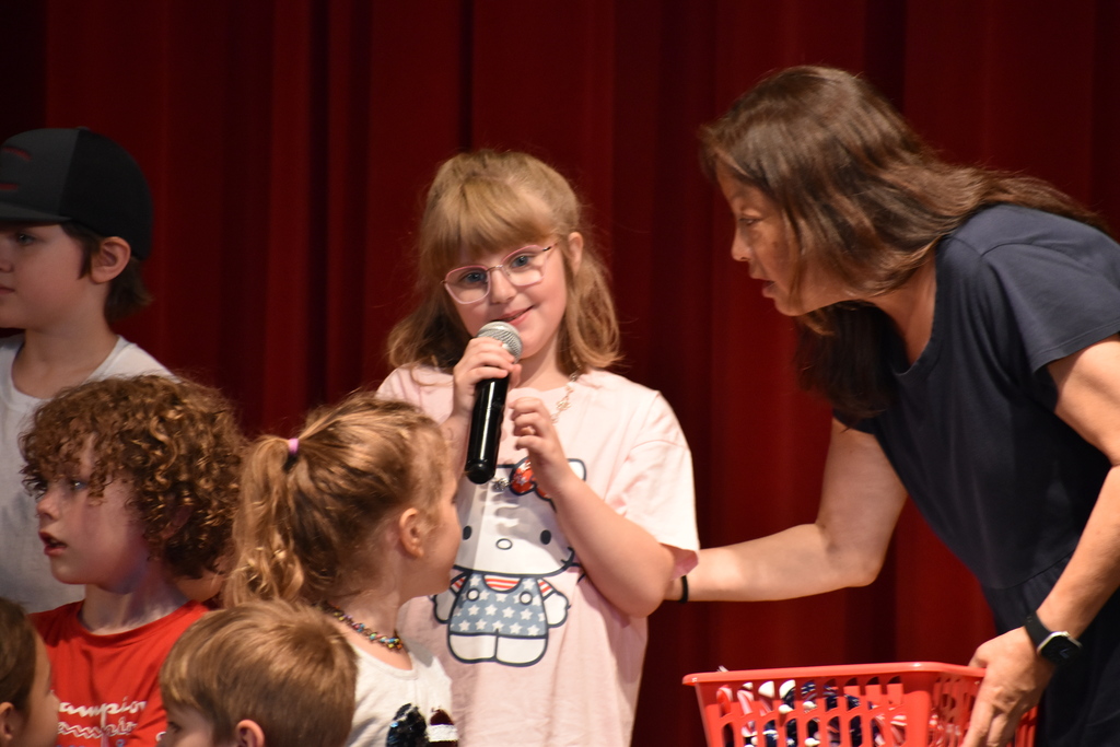 ELEMENTARY STUDENT DURING MEMORIAL DAY ASSEMBLY 