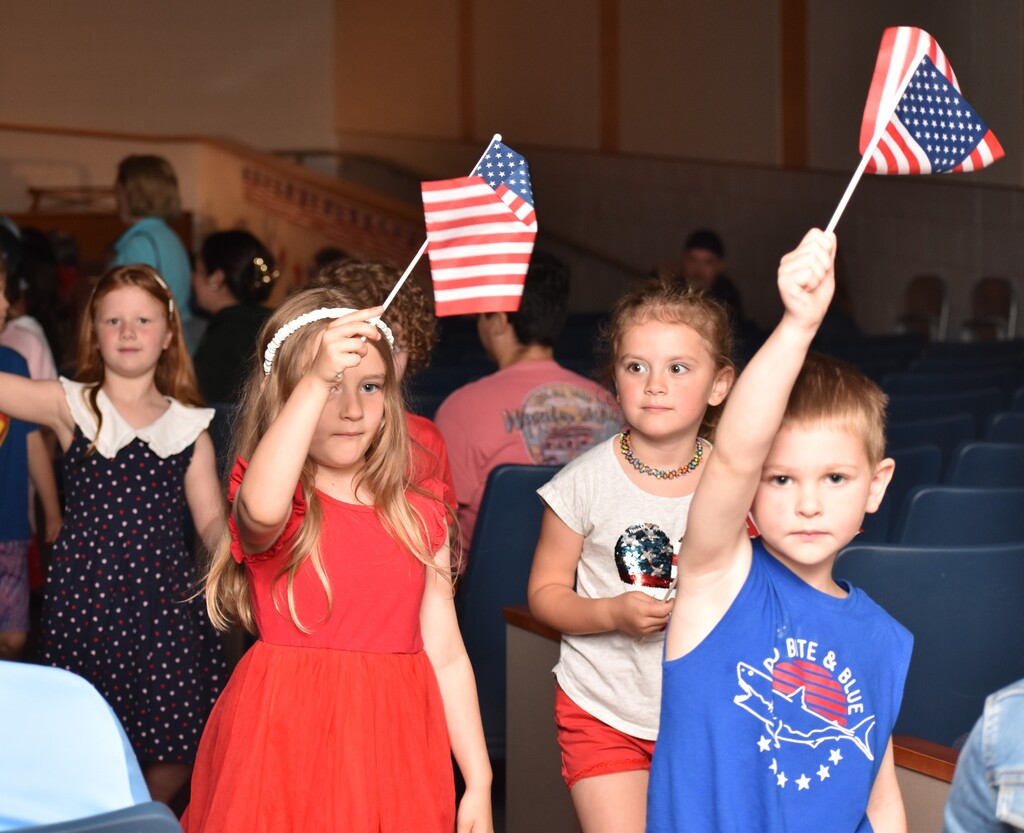 ELEMENTARY STUDENT DURING MEMORIAL DAY ASSEMBLY 