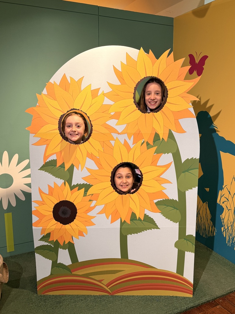 elementary students in flower cut out frame