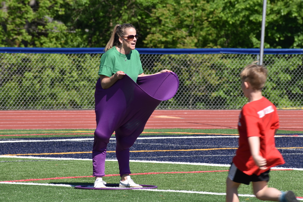 teacher in carnival game pants