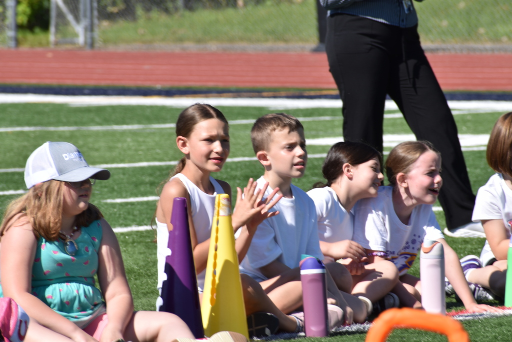 elementary students on football field 
