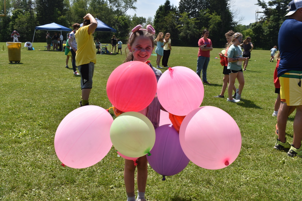 elementary student with balloons